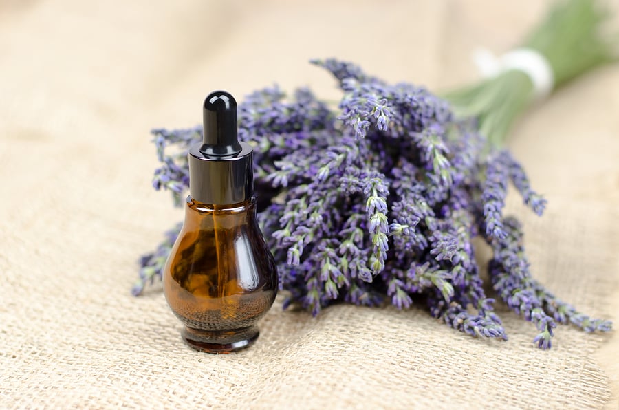 bigstock-A-Bottle-Of-Lavender-Oil-On-Sa-426283580
