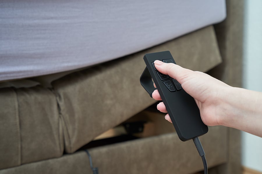 bigstock-Female-Hand-And-Remote-Control-332265661