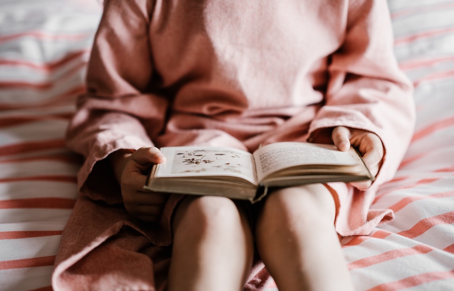 woman reading on bed-1